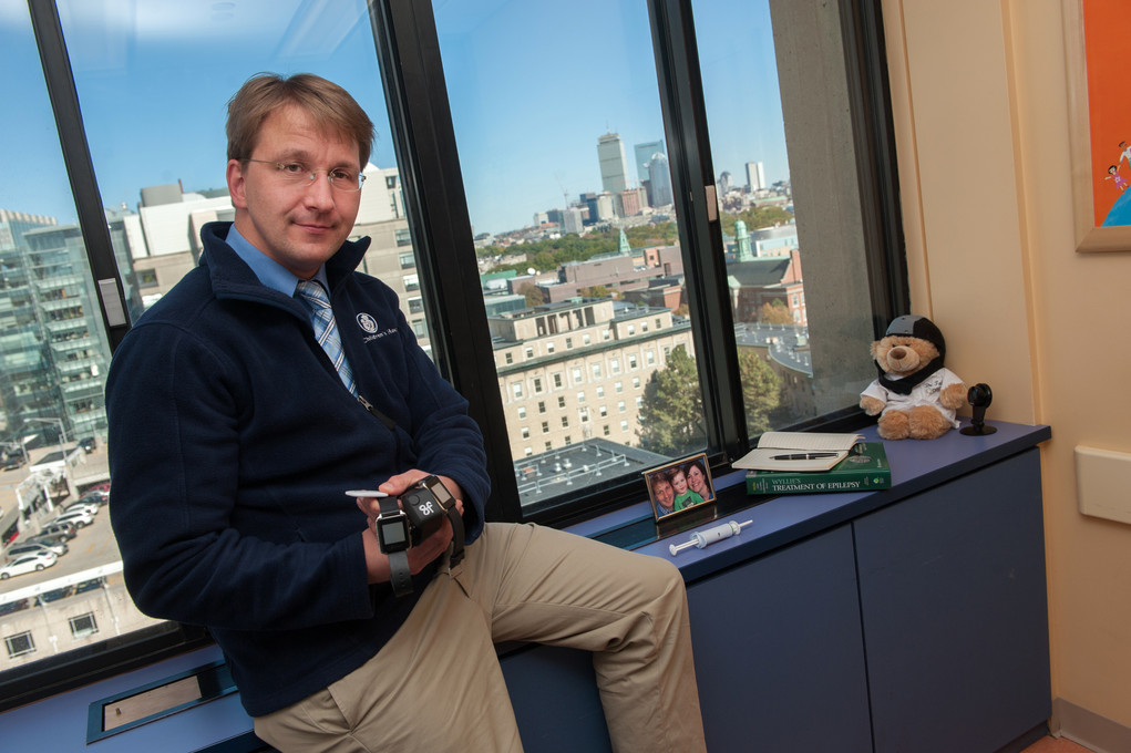 Tobias Loddenkemper of the Loddenkemper Lab sits on his desk.