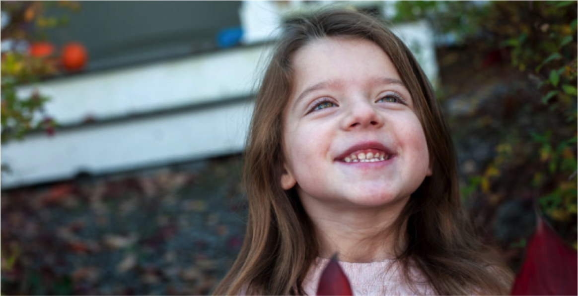 Girl smiling looking up