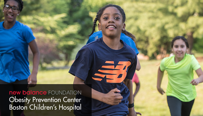 Kids running with a girl wearing a New Balance shirt - obesity prevention