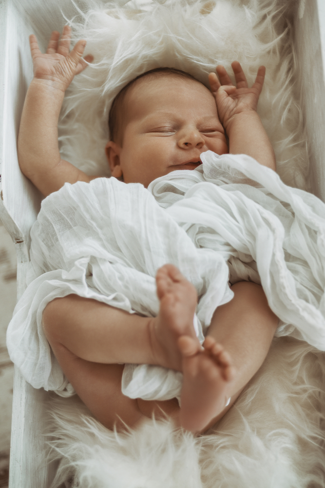 A baby in a crib.